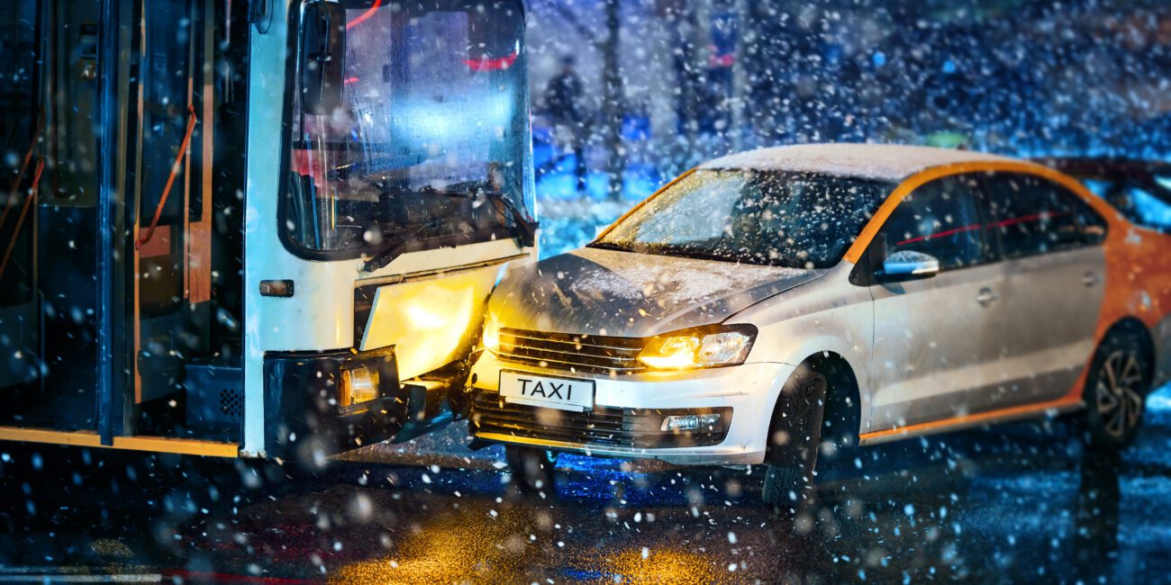 bus accident on wet street on a snowy evening shows importance of a bus accident lawyer