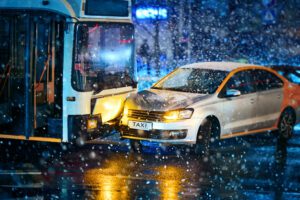 bus accident on wet street on a snowy evening shows importance of a bus accident lawyer