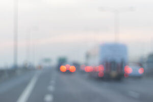 blurred highway with cars to represent fatigue-related accidents