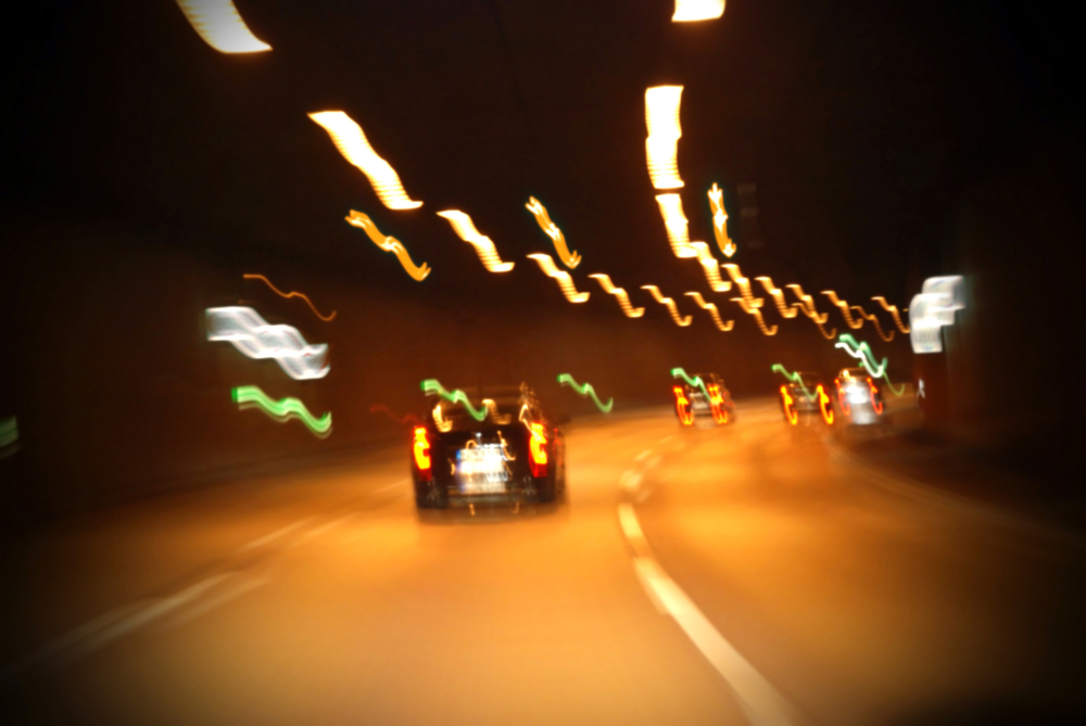 blurry freeway at night with cars and lights